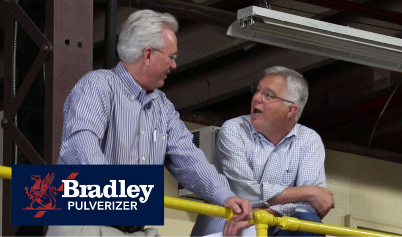 Tom Garrity talking with owner of Bradley Pulverizer