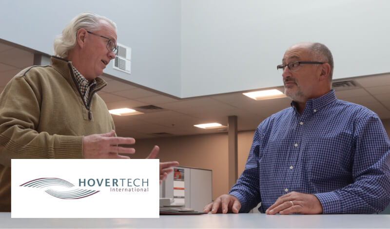 Tom Garrity talking with owner of Hovertech